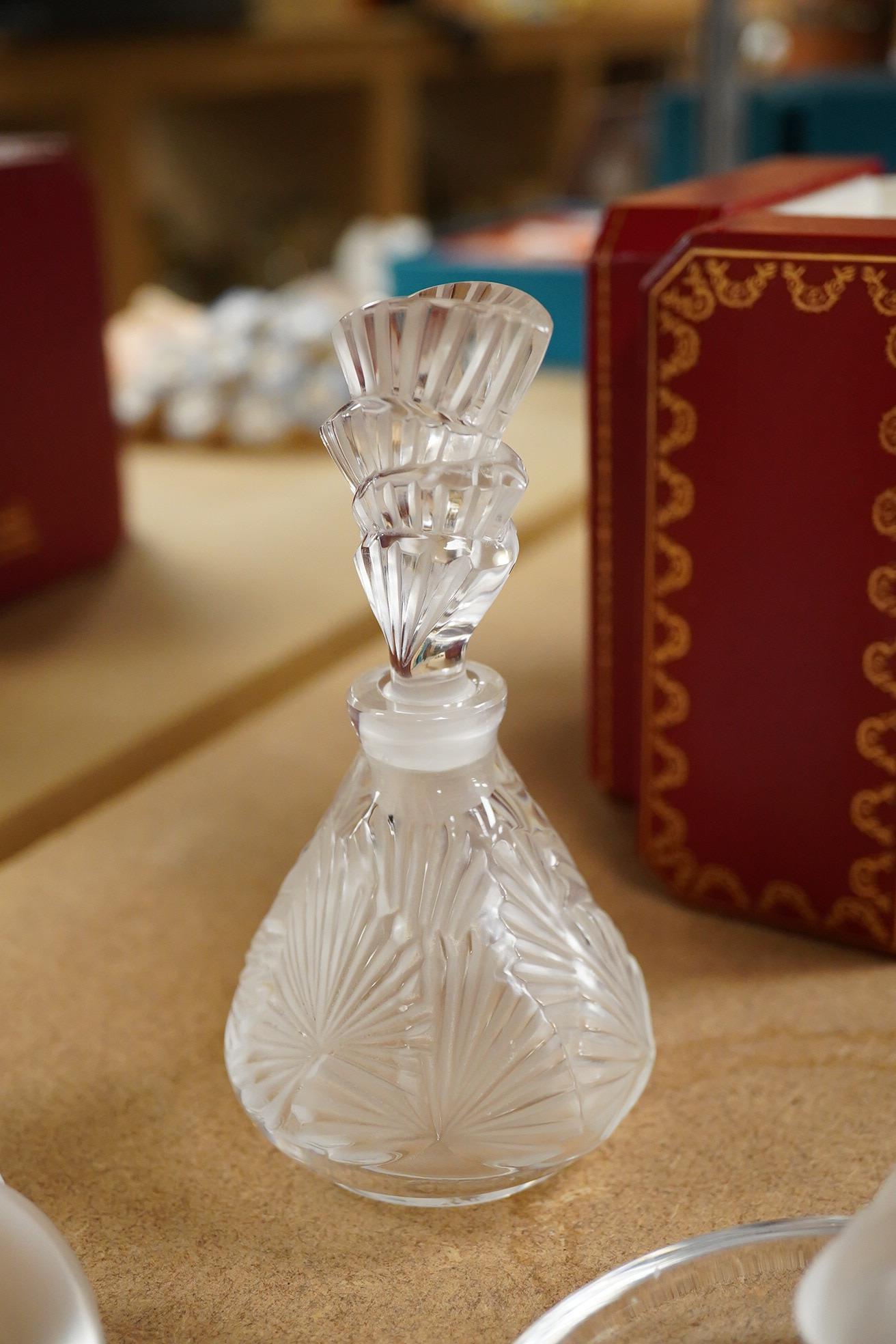 A Lalique scent bottle with stopper, a Lalique lovebirds pin-dish and and a Lalique heart-shape knot, scent bottle 12cm